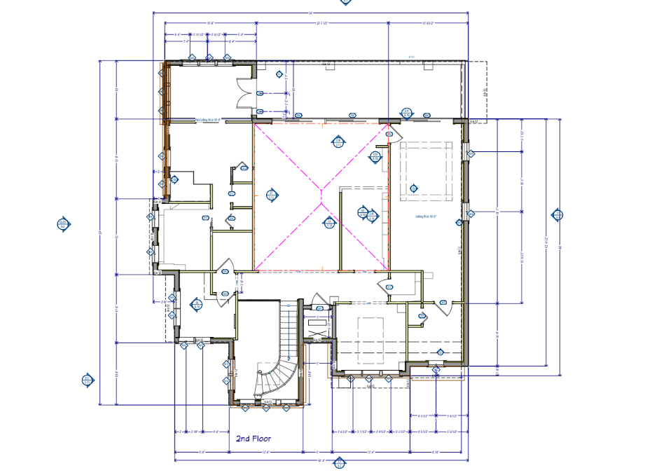 Architectural floor plan of a two-story building with room layouts, dimensions, and symbols.
