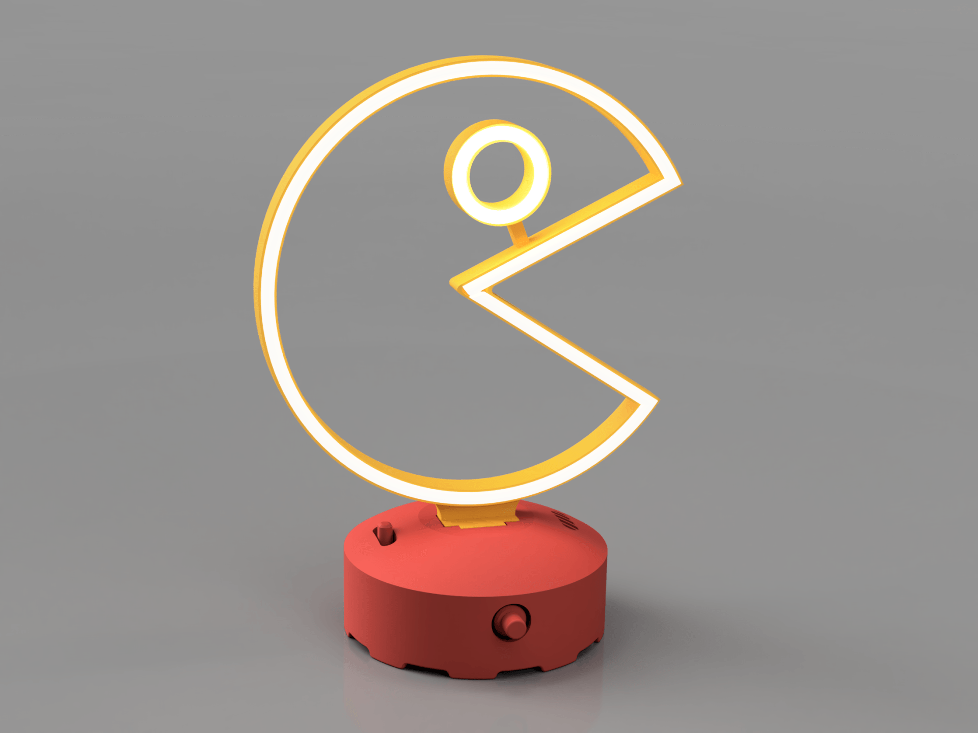 A Pac-Man-shaped LED neon desk lamp with a warm yellow outline, mounted on a round, matte red base against a gray background.