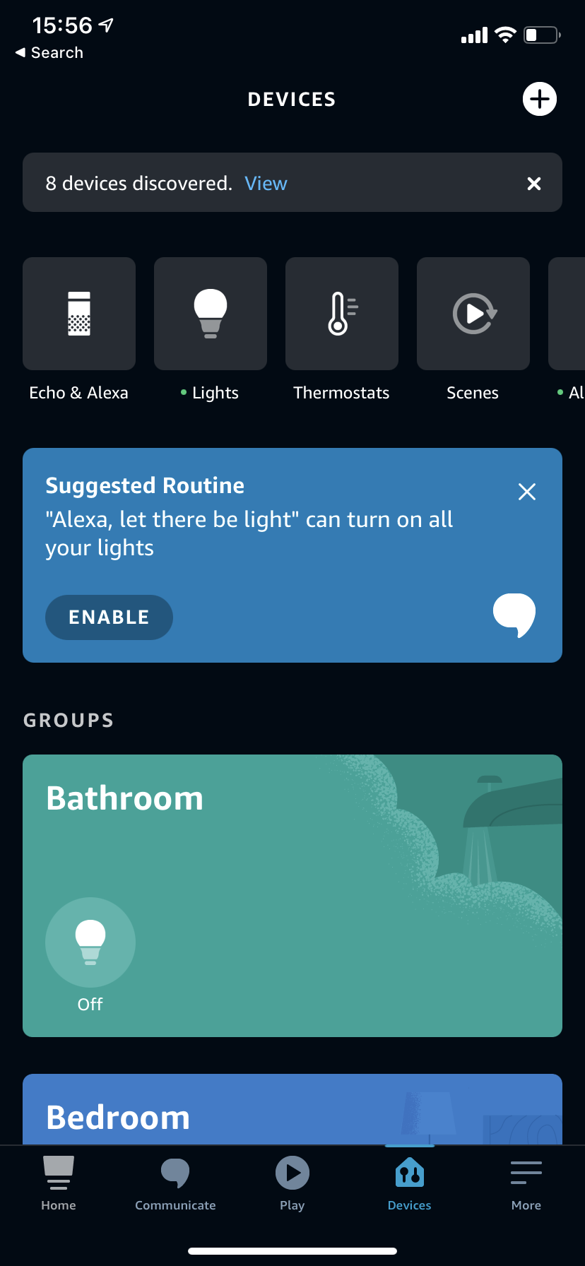 Smart home app dashboard showing a list of rooms, device controls, and a suggestion notification on a dark background.