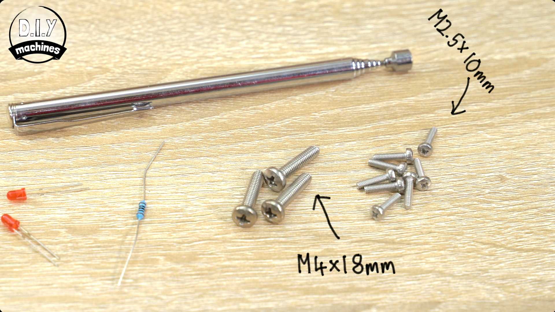A top-down view of electronics parts: a telescopic antenna, two LEDs, a resistor, and various M2.5 and M4 screws.