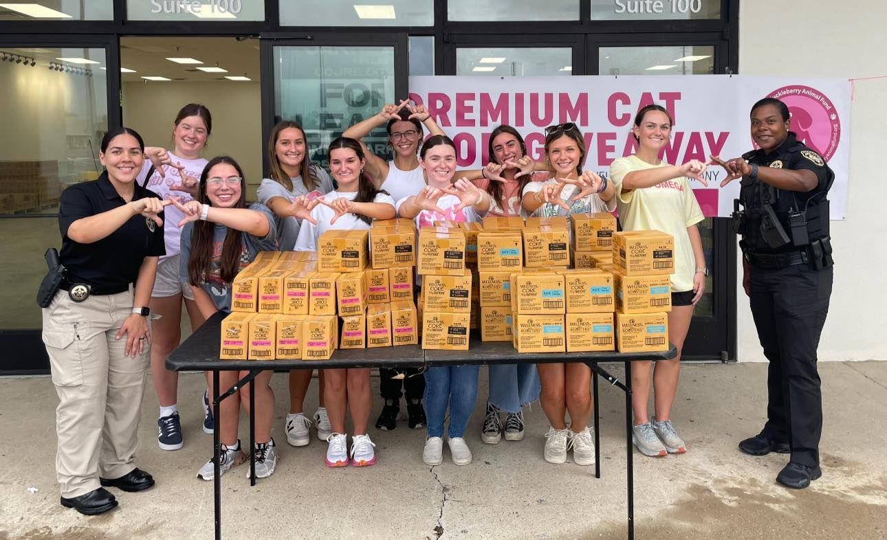 Ward 3 Deputies with volunteers for cat food giveaway