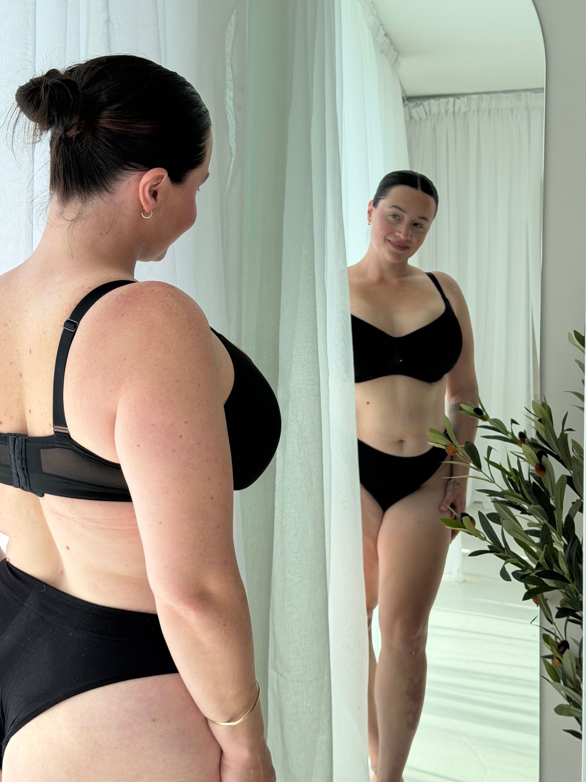 Danielle looking at her reflection in the mirror