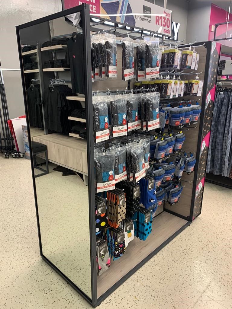 CLOTHING FIXTURES: KK Shelving (see image)