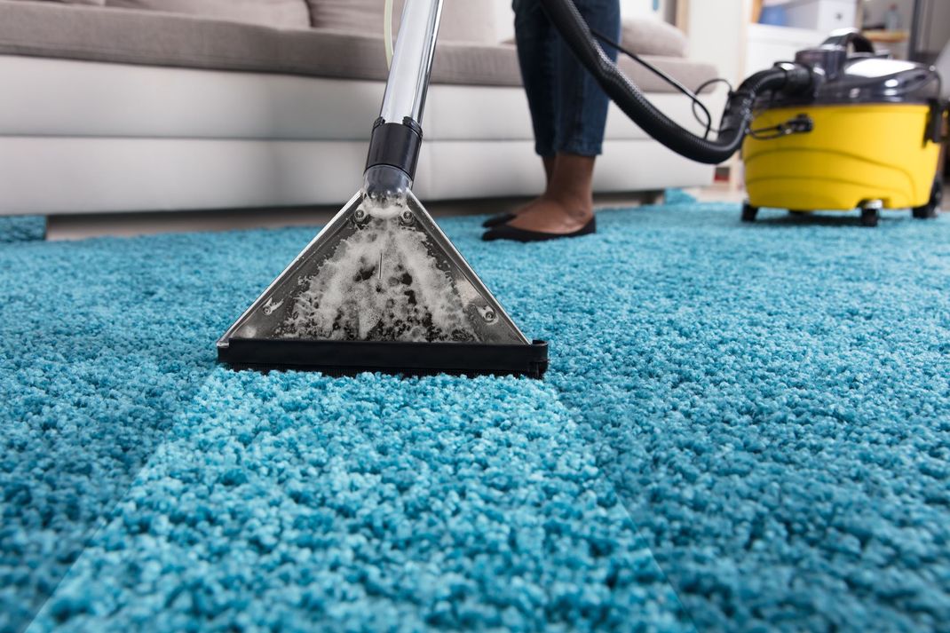 Cleaning a Carpet With Vacuum Cleaner