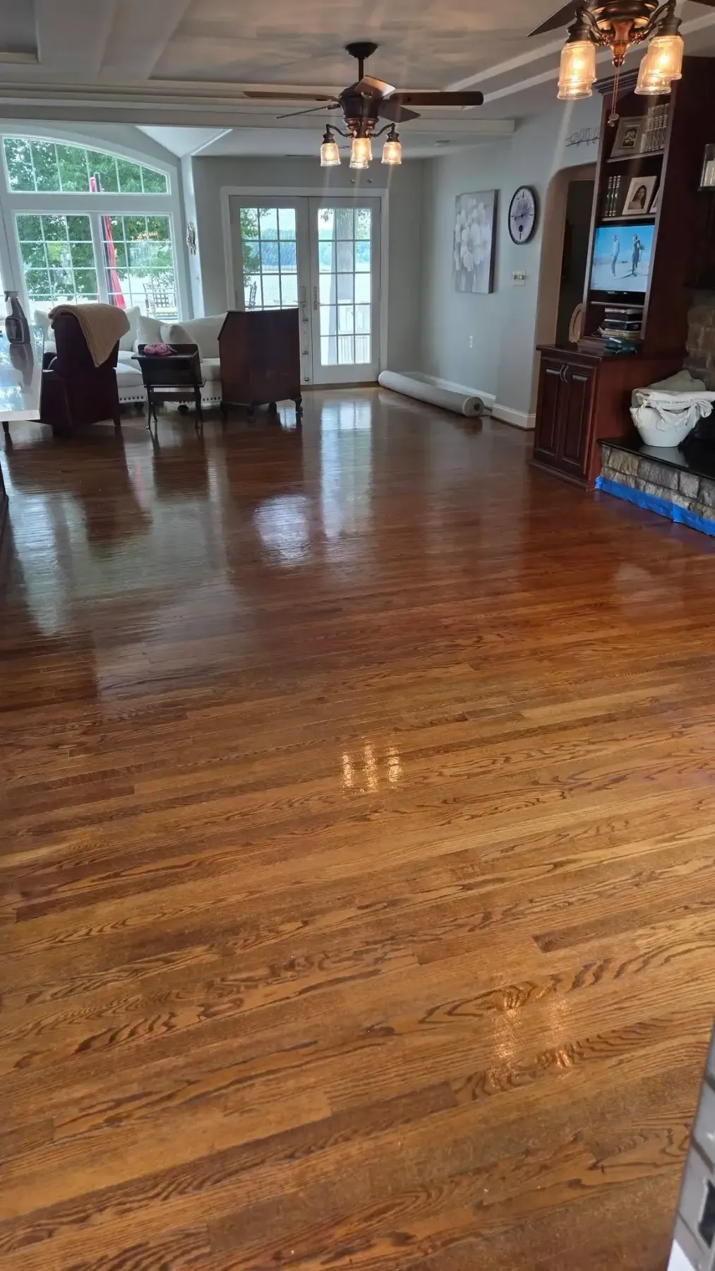 Close-up of rich hardwood floor grain with warm amber and walnut tones