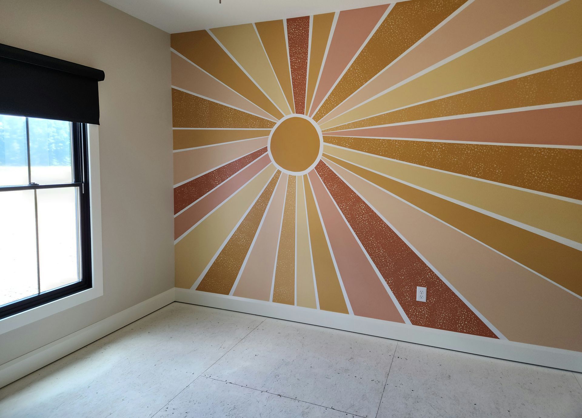 A room with a painting of the sun on the wall artist teen room