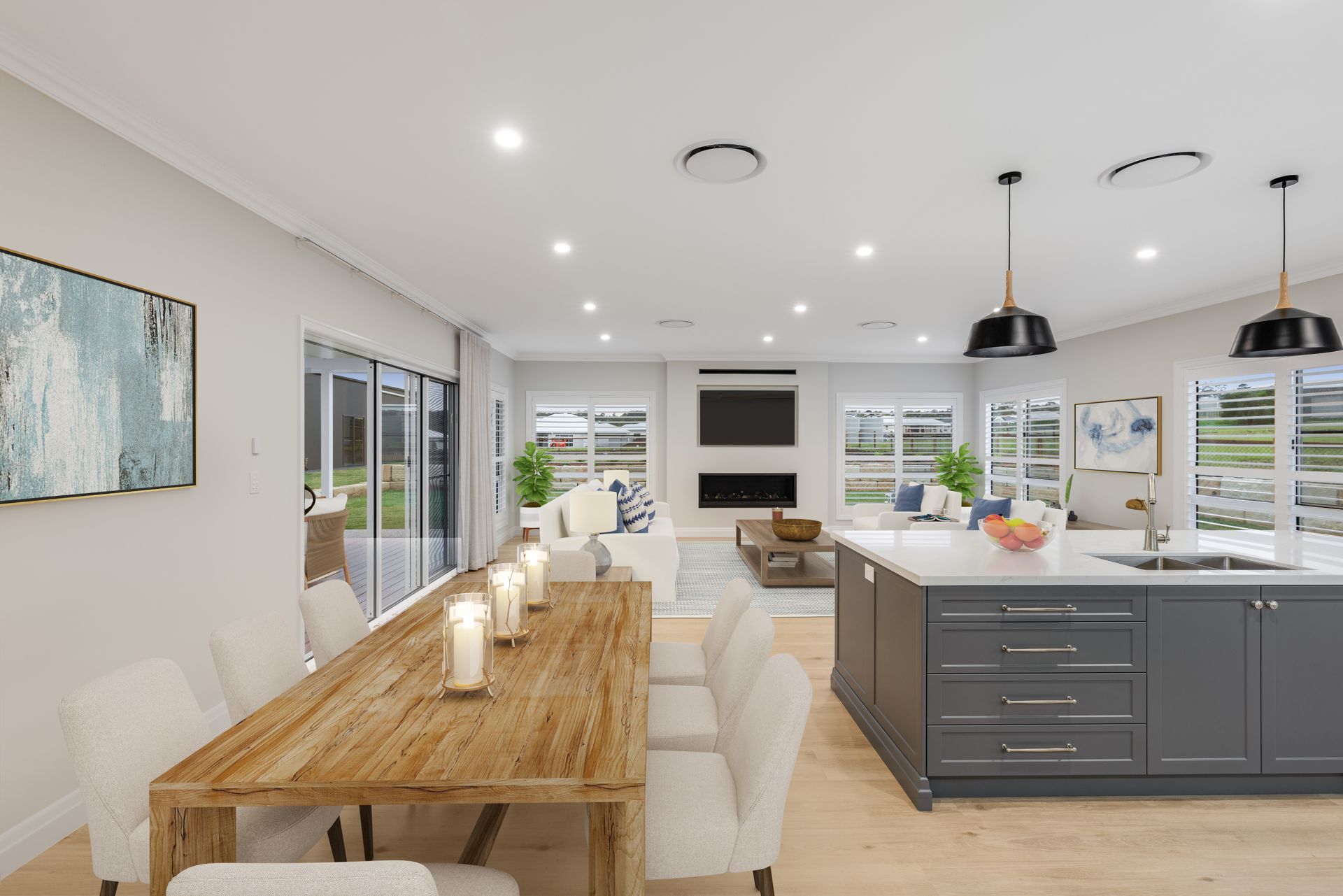 Dining room with oval wooden table, six chairs, and a hanging light fixture. Patio with view is visible.