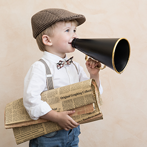 Young child in newsboy cap shouts into a megaphone, carrying a newspaper satchel.