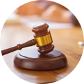 Wooden gavel on its block, used in court.