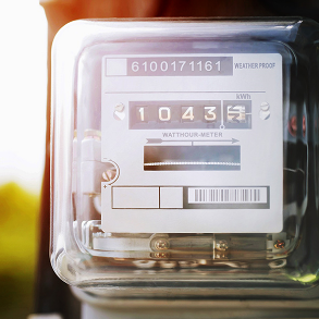 Electricity meter displays a reading of 1043 kWh, in a clear, weather-proof case.