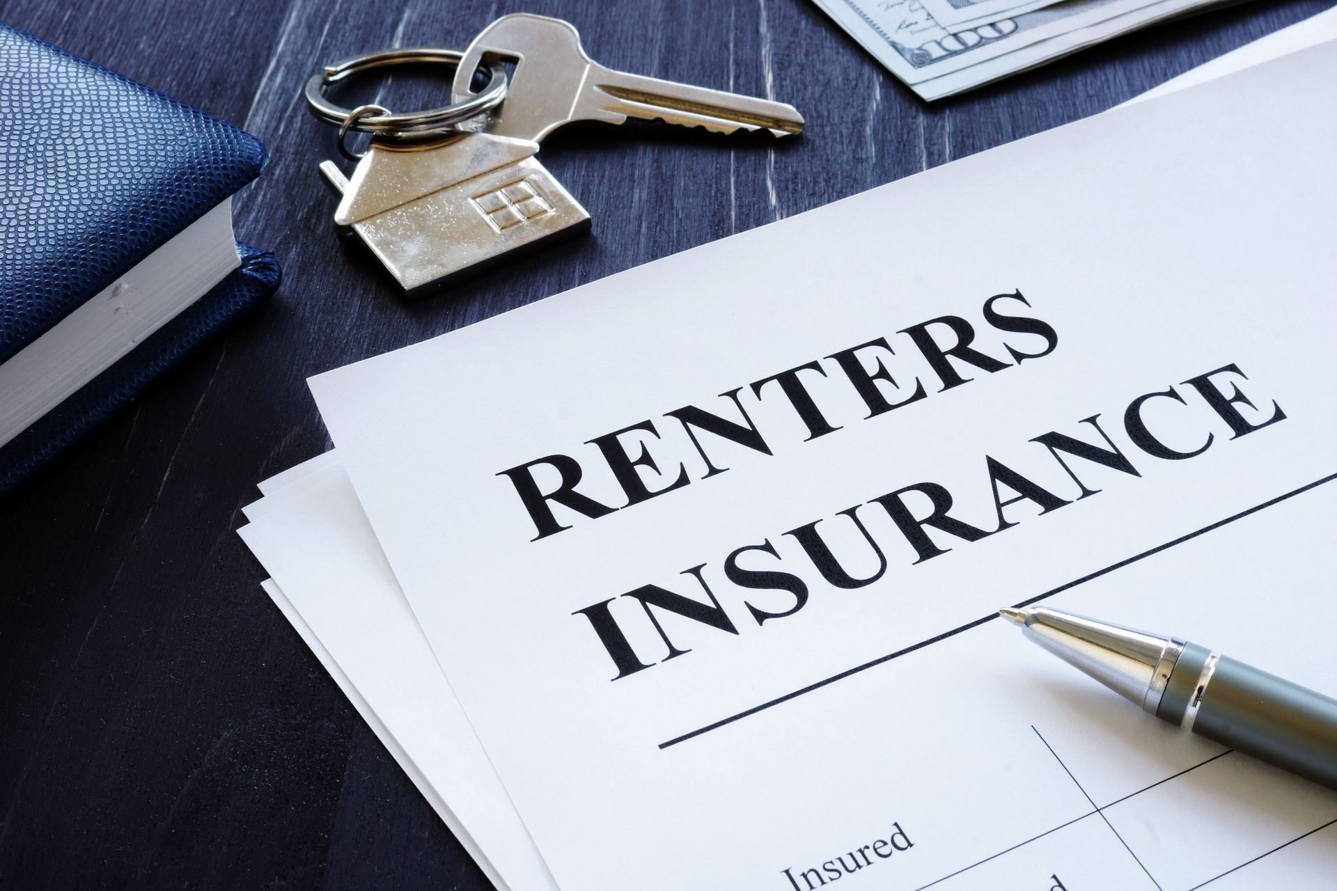 Renters insurance in Bozeman, MT policy agreement with apartment key, highlighting the importance of tenant protection. Renters insurance in Bozeman, MT policy agreement with apartment key, highlighting the importance of tenant protection.