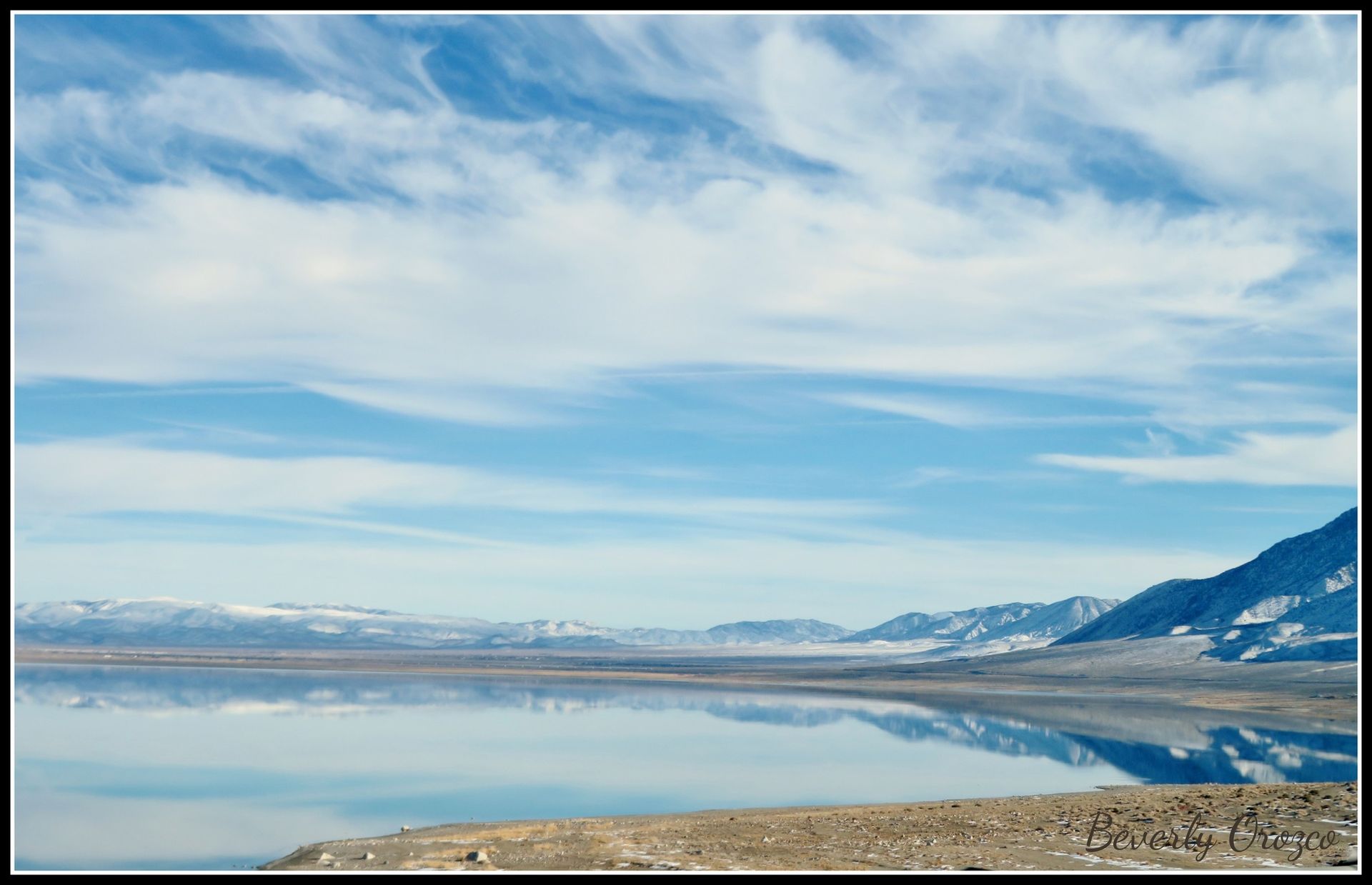 A picture of a lake with mountains in the background