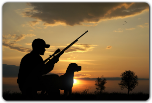 Hunter with dog at lake
