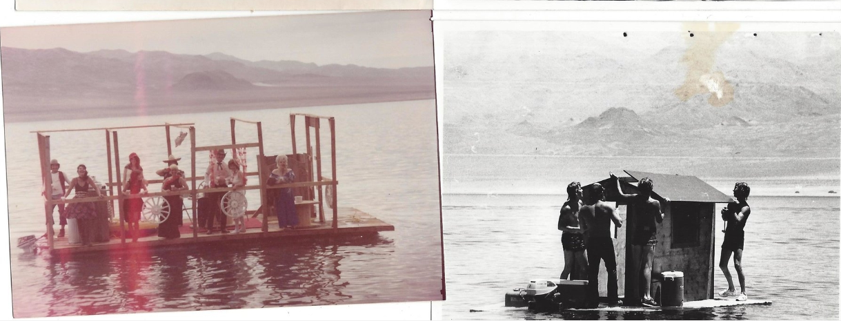 A group of people standing on a raft in the water