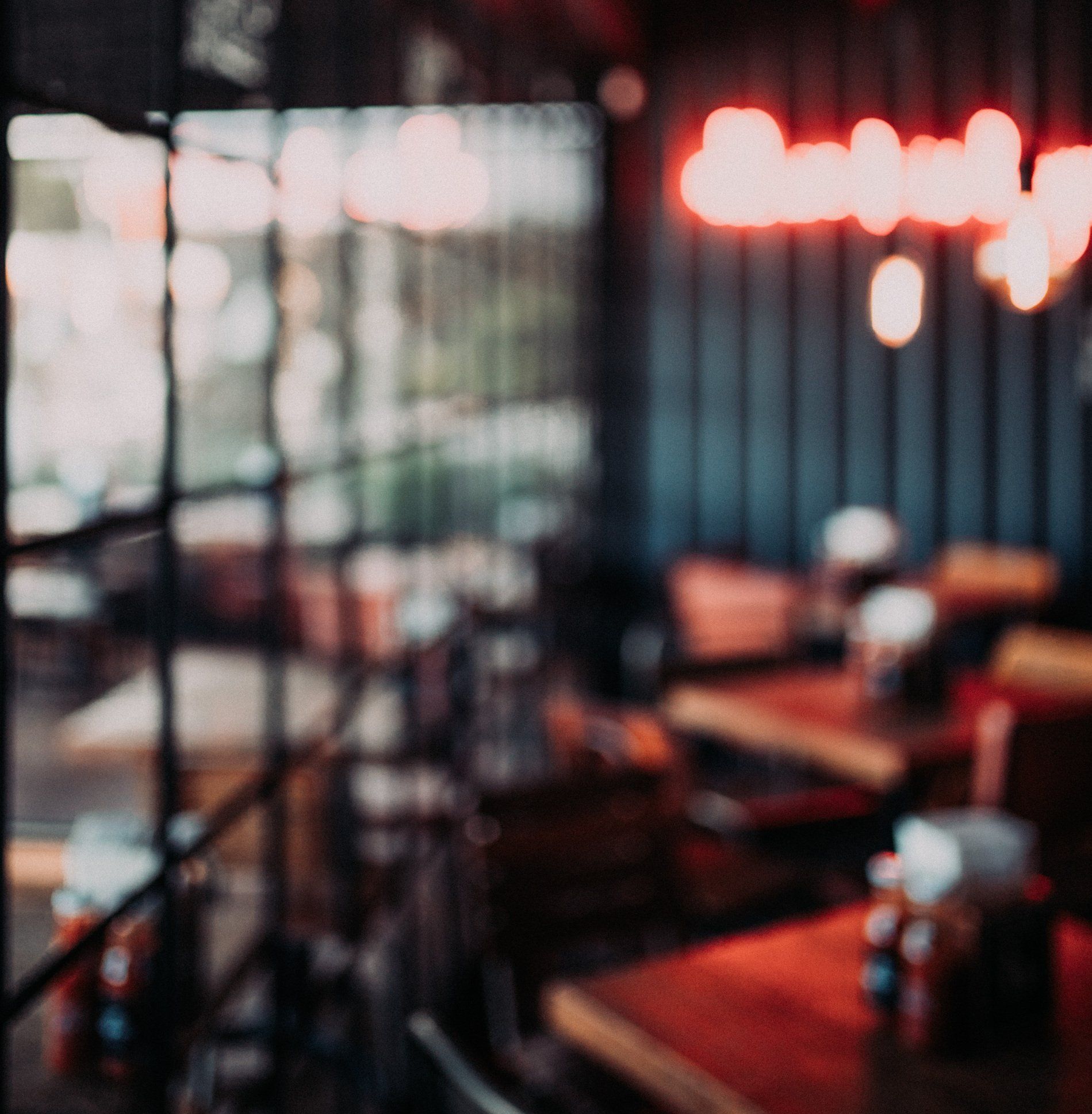 A blurry picture of a restaurant with tables and chairs