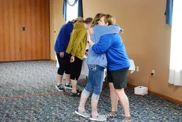 Hugging at Healing Hope Ministries, showing we're with you through the grieving process