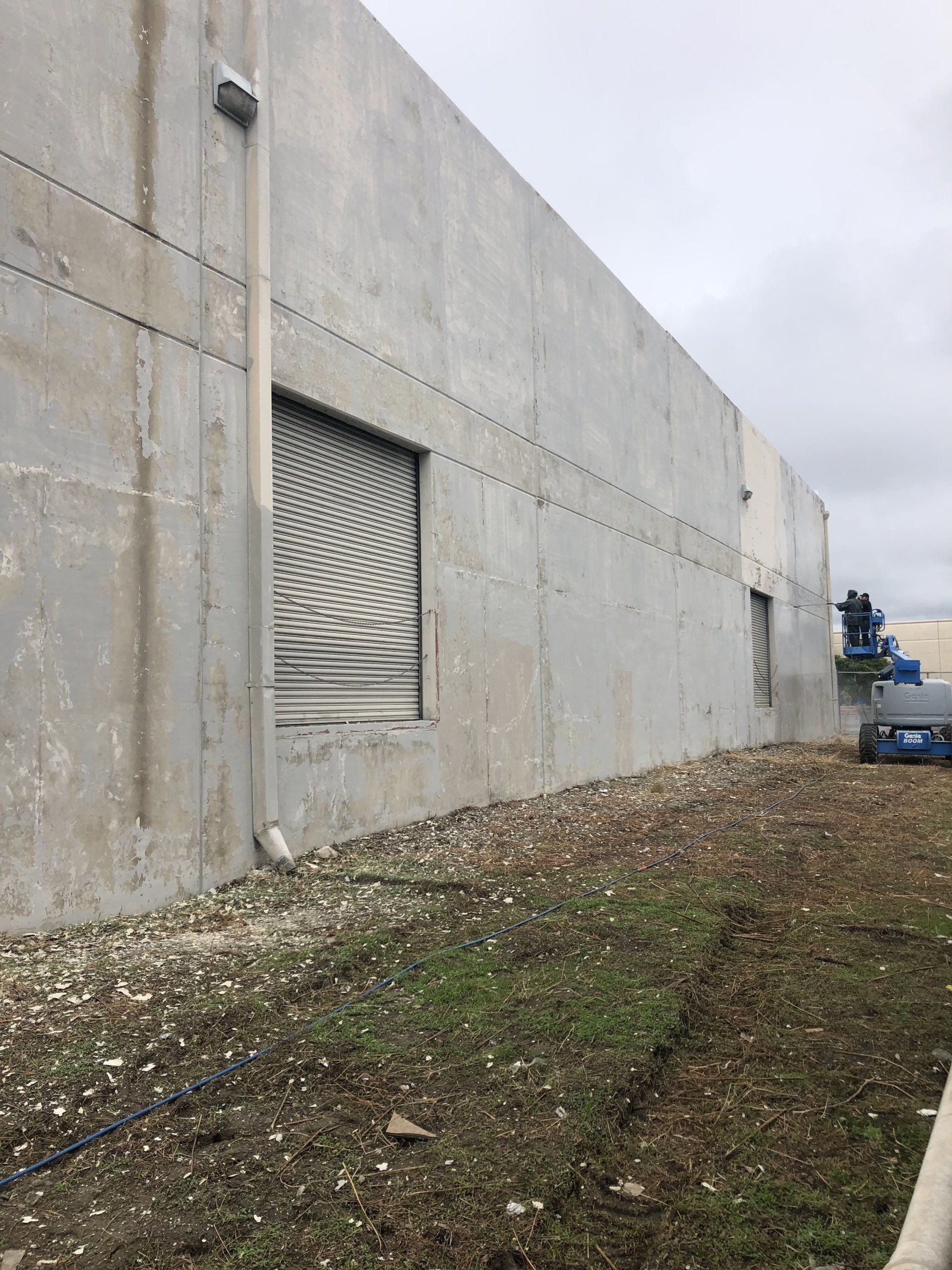 Commercial building pressure washing before removing