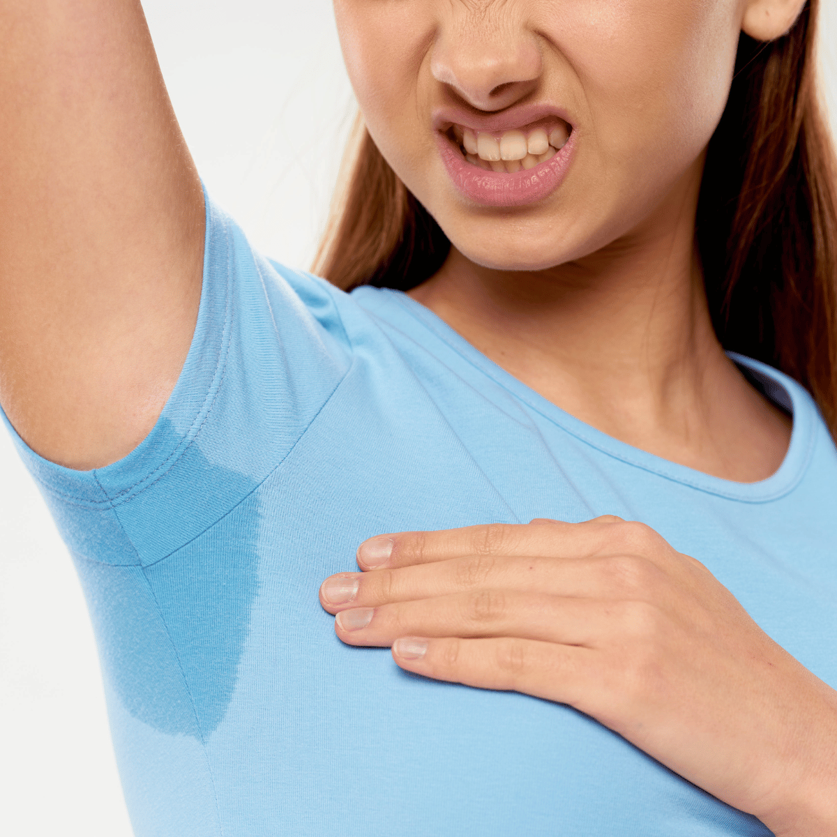 Woman uncomfortable with excessive underarm sweating - YAAN Clinic Gangnam, Seoul
