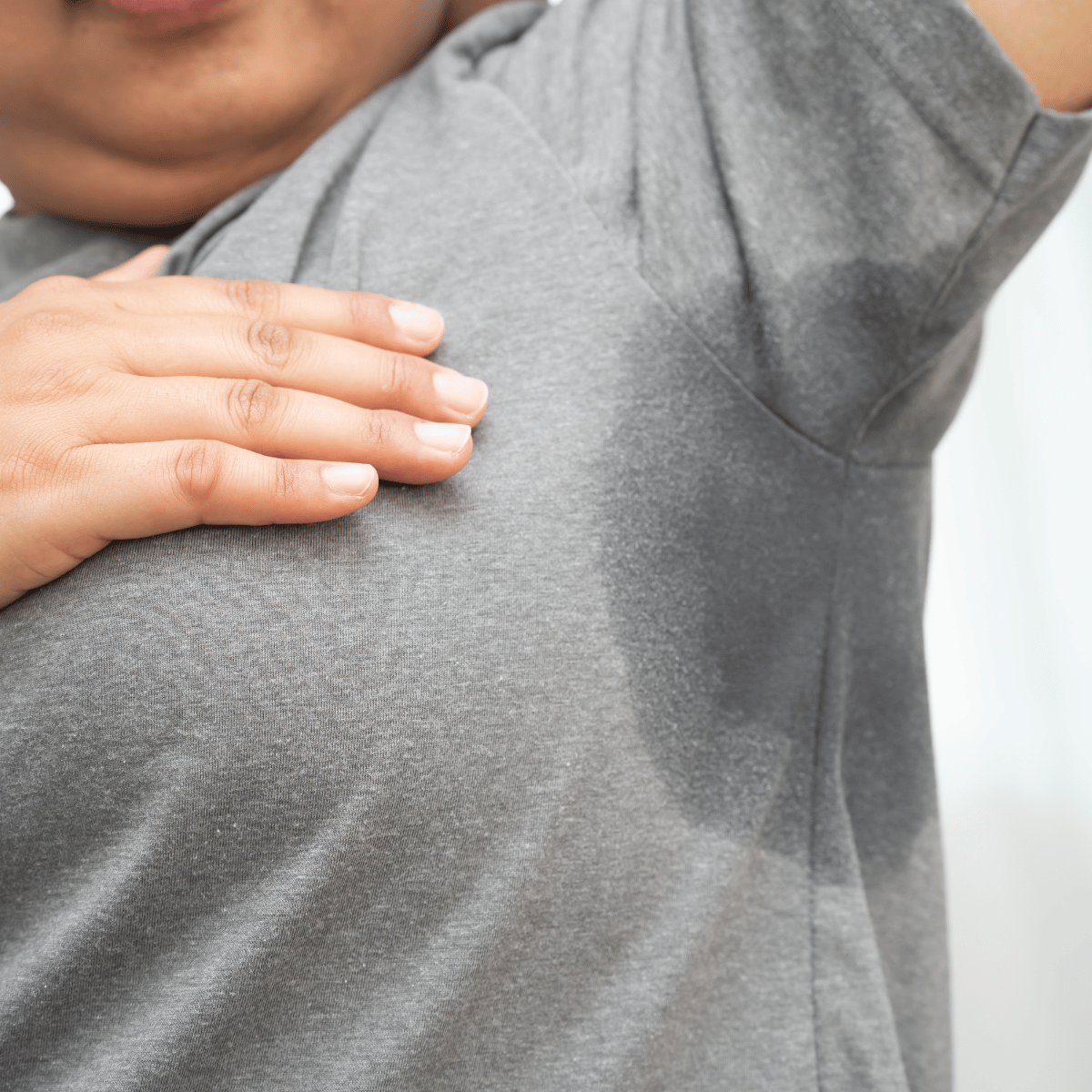 Visible underarm sweat stains on a grey shirt - YAAN Clinic Gangnam, Seoul