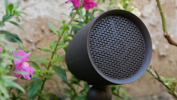 Sonance outdoor spotlight speaker installed in garden — Earl Outdoor Solutions Omaha