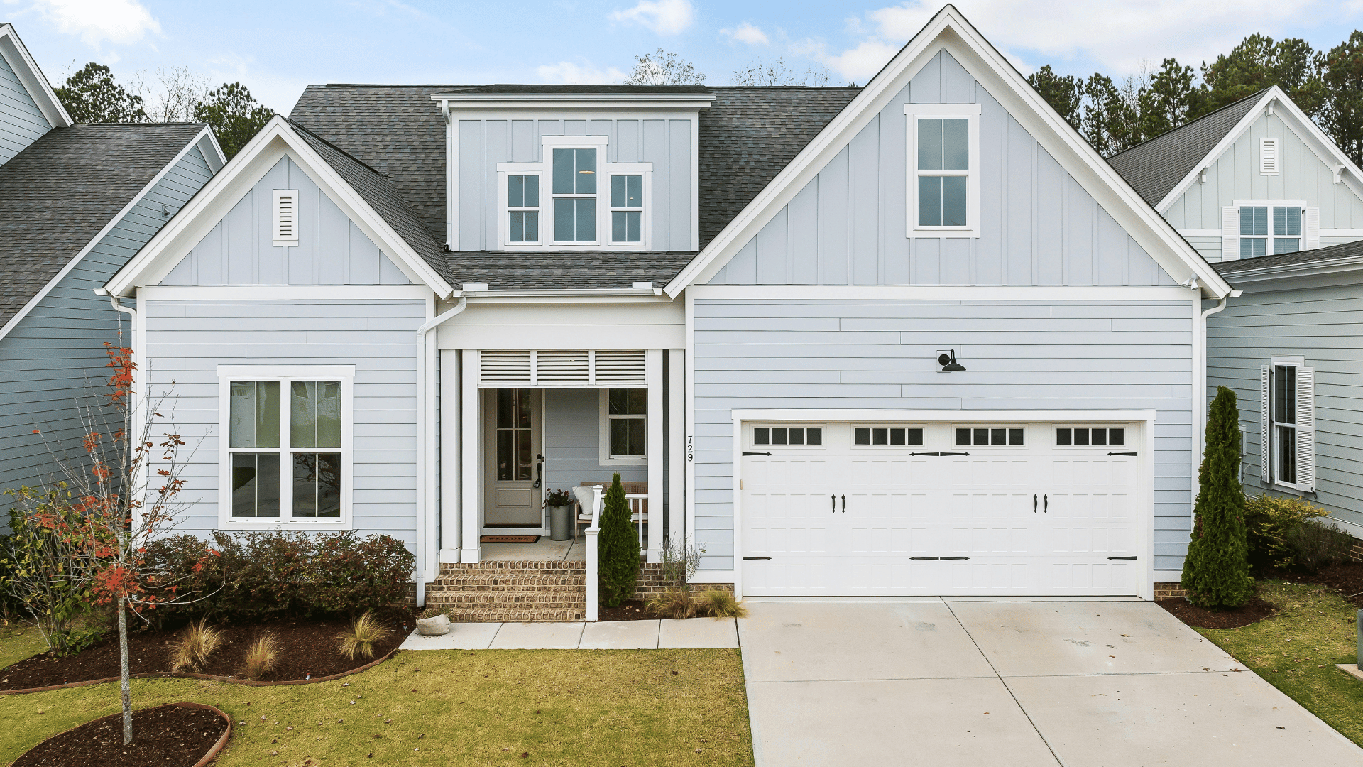 Custom modular garage installation with garage doors, windows, and secure vehicle storage