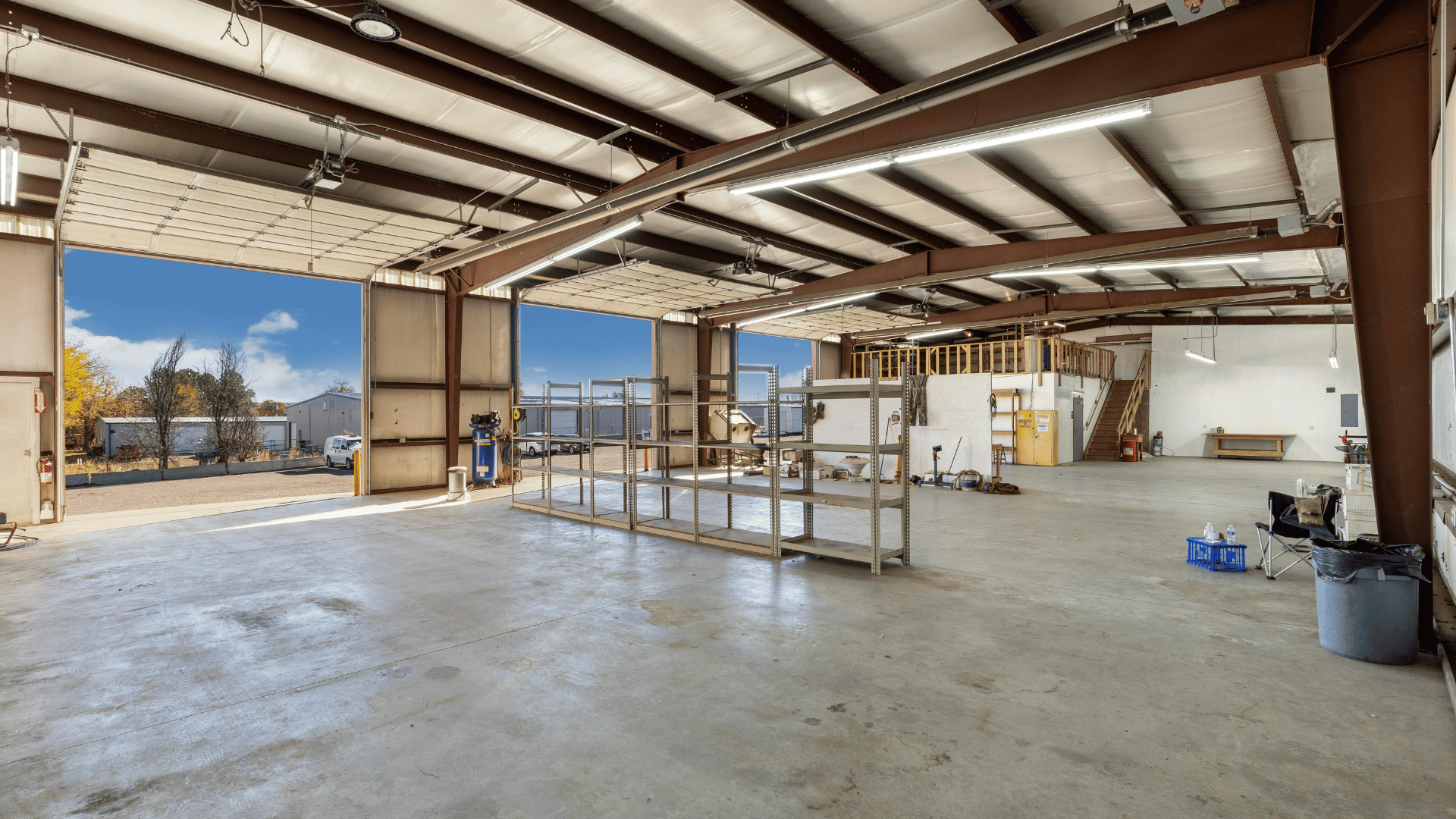 Detached two-car modular garage with organized vehicle and equipment storage