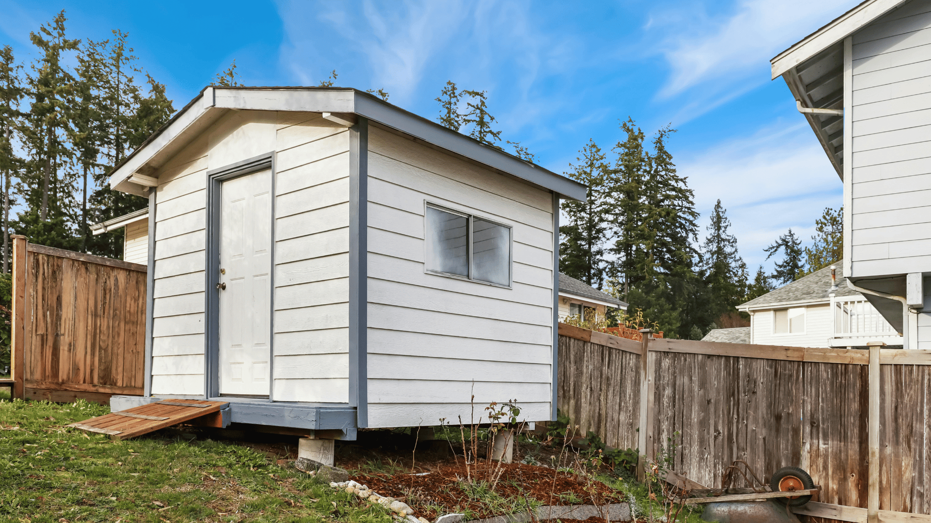 Custom storage shed providing organized outdoor storage for lawn equipment, bicycles, tools, and seasonal belongings