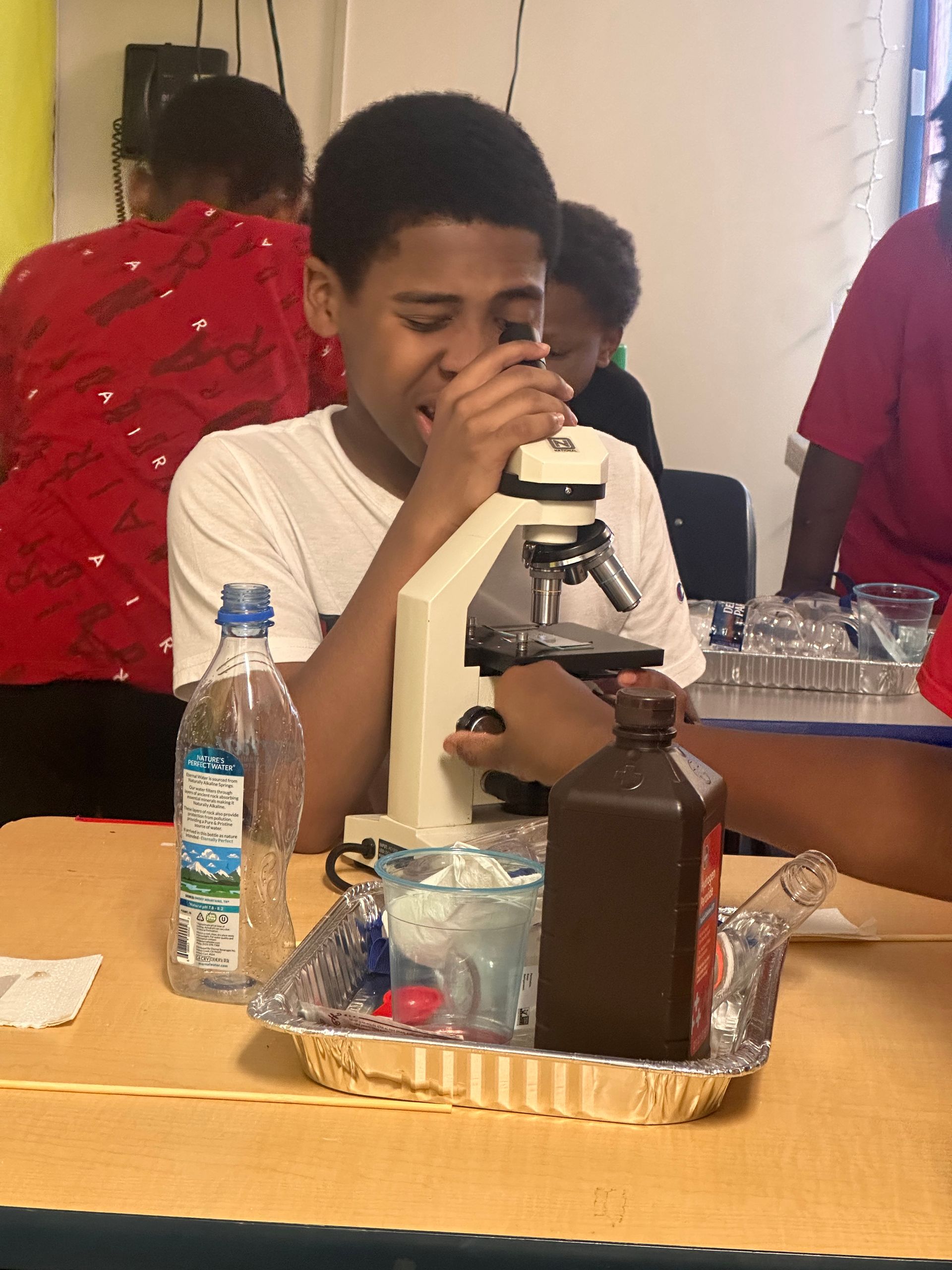 student is using telescope