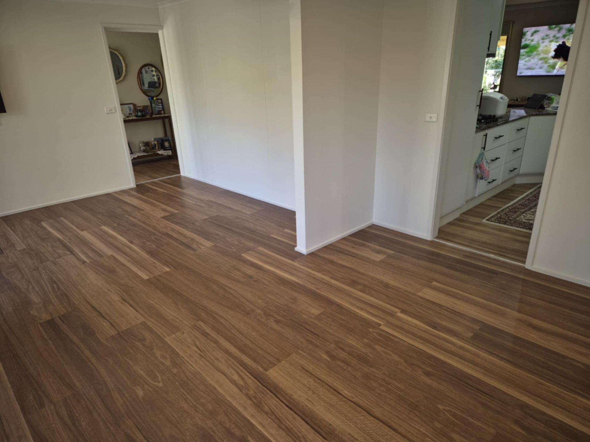 Wooden Floorboards in A Home, Leading to Doorways. Walls Are White — Canberra Floor Coverings in Queanbeyan West, NSW