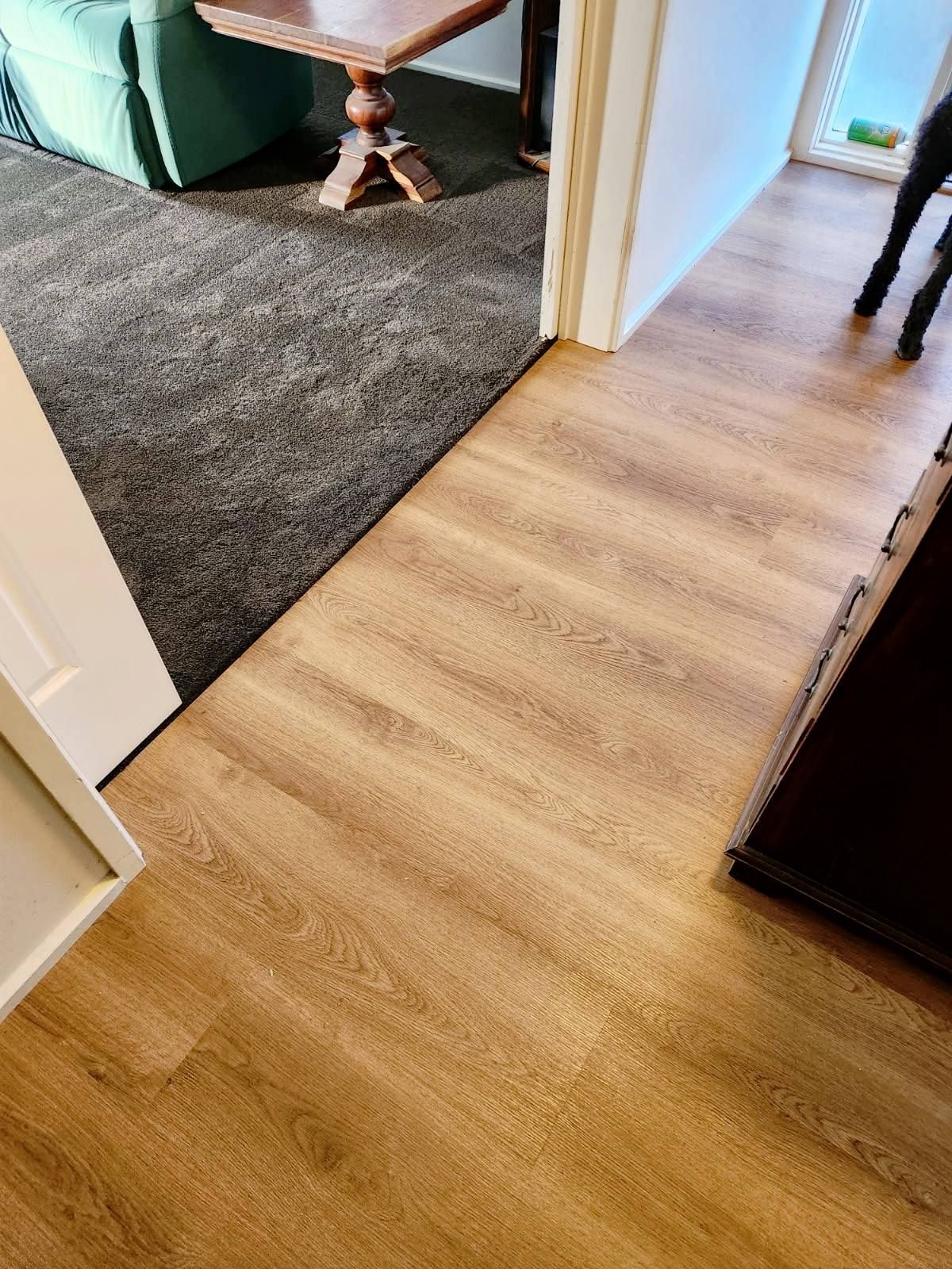 Light-Brown Wood-Look Flooring Transitions to Grey Carpet — Canberra Floor Coverings in Queanbeyan West, NSW