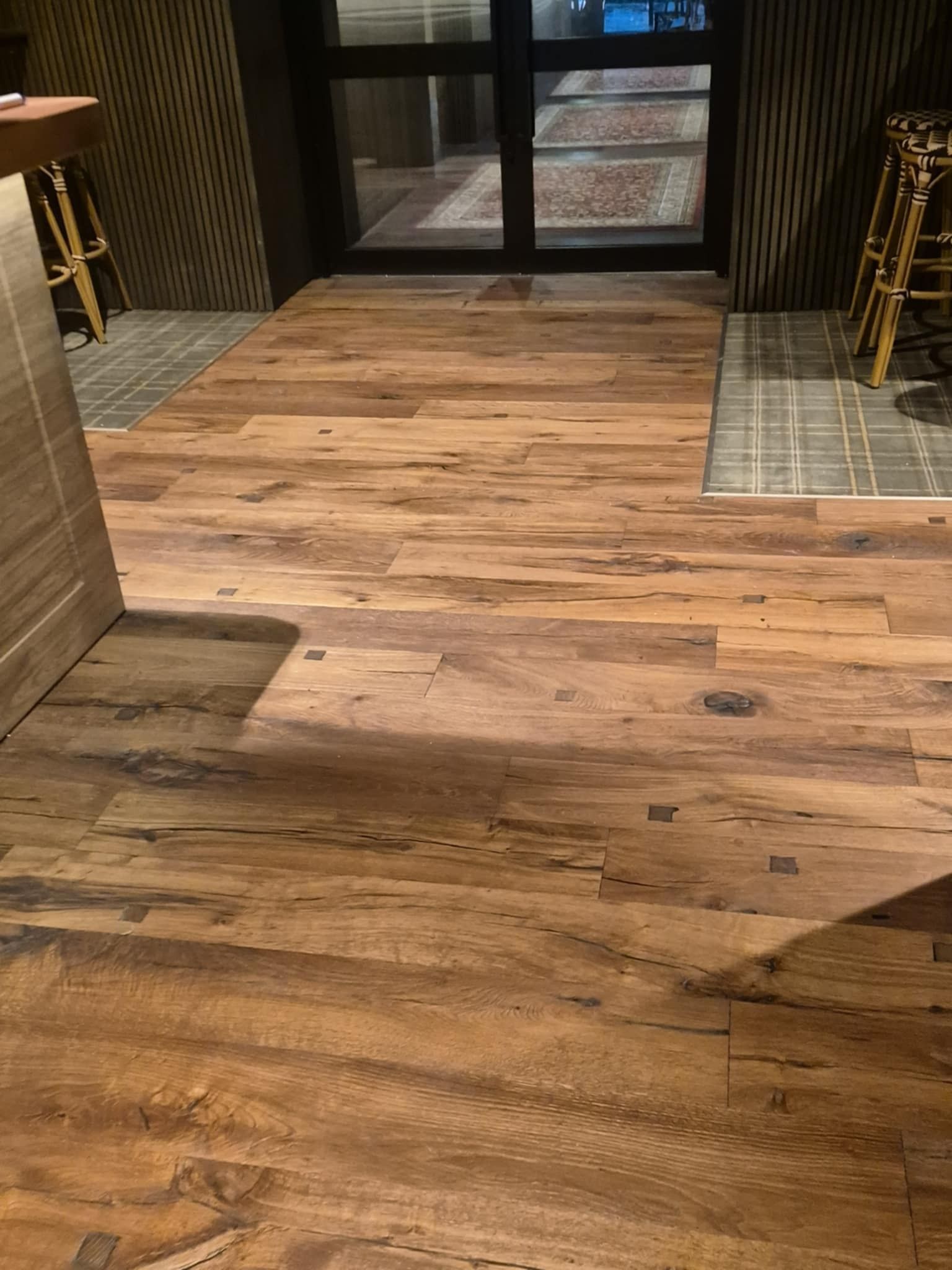 Wooden Floor Leads to Glass Doors; Tiled Areas on Either Side — Canberra Floor Coverings in Queanbeyan West, NSW