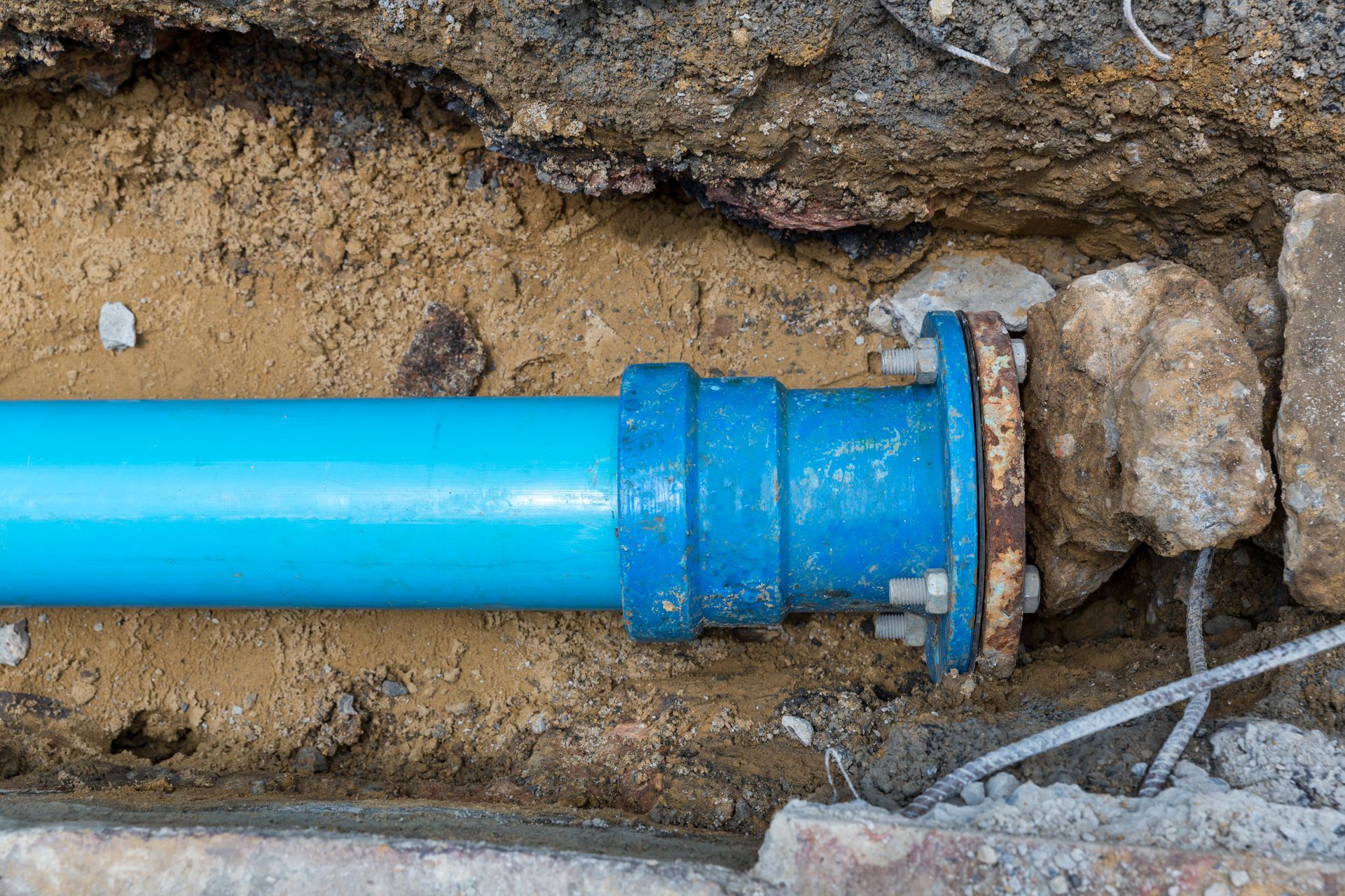 Freshly installed water pipes buried underground, ready to supply clean water to homes and businesses.