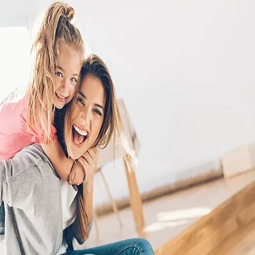 woman and small girl having a great time together