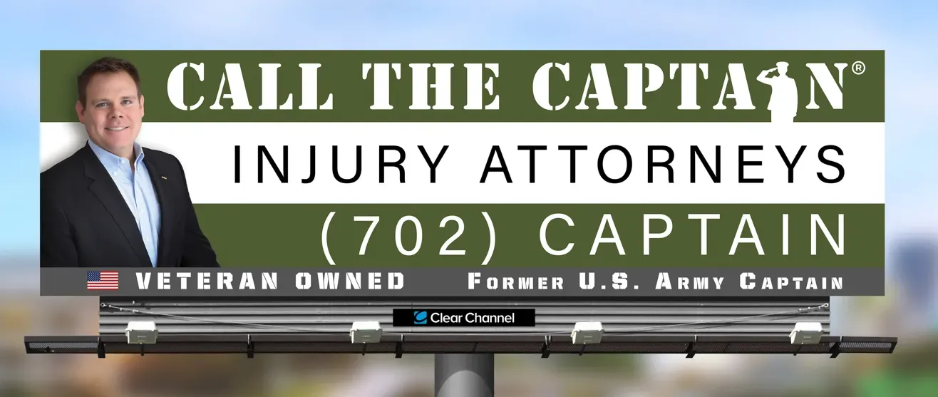 Law office banner for “Call the Captain Injury Attorneys,” featuring a suited man and an American flag