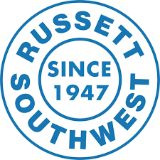 Blue circular Russell Southwest logo with “Since 1947” in the center.