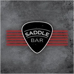 Black guitar pick logo reading “SADDLE BAR” with red horizontal stripes on a gray textured background