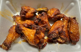 Wings in a takeout container