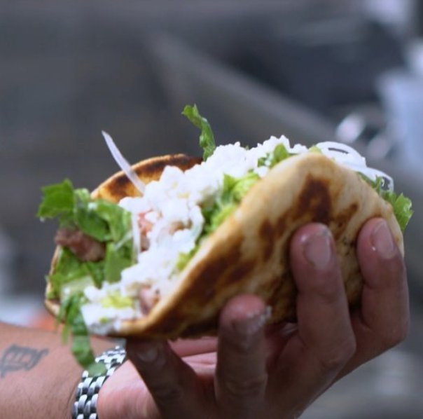 Chef Von holding up a fish taco