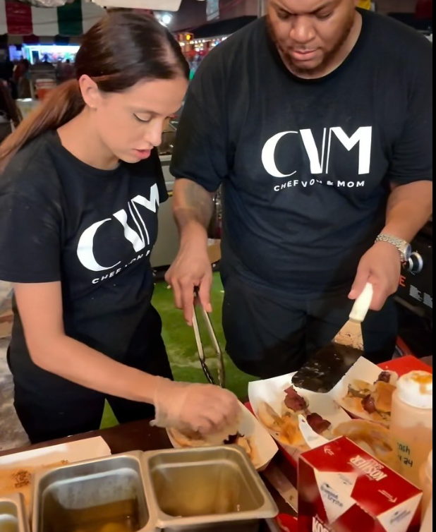 Chef Von cooking with another woman in branded tshirts