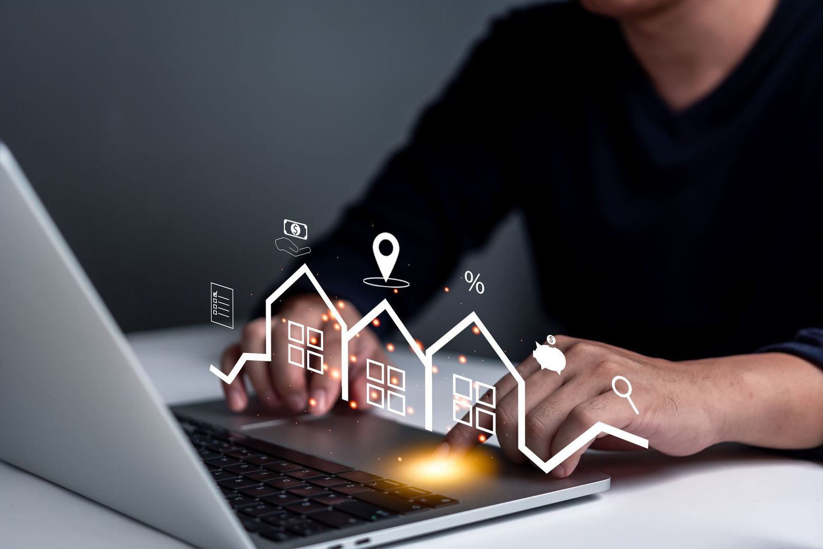 Person using a laptop with a glowing smart home interface overlay on the screen
