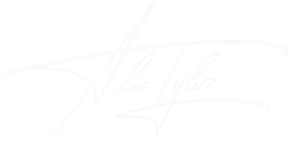 Very faint white cursive text on a white background, nearly invisible