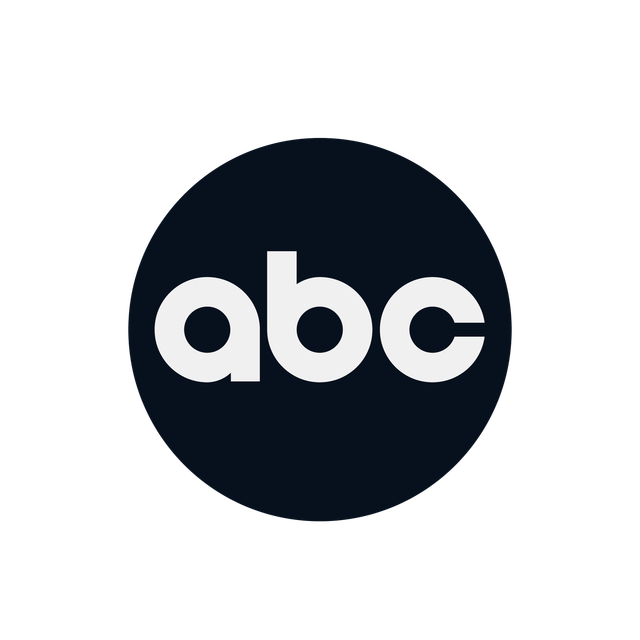 White “abc” letters inside a dark navy circle logo on a white background