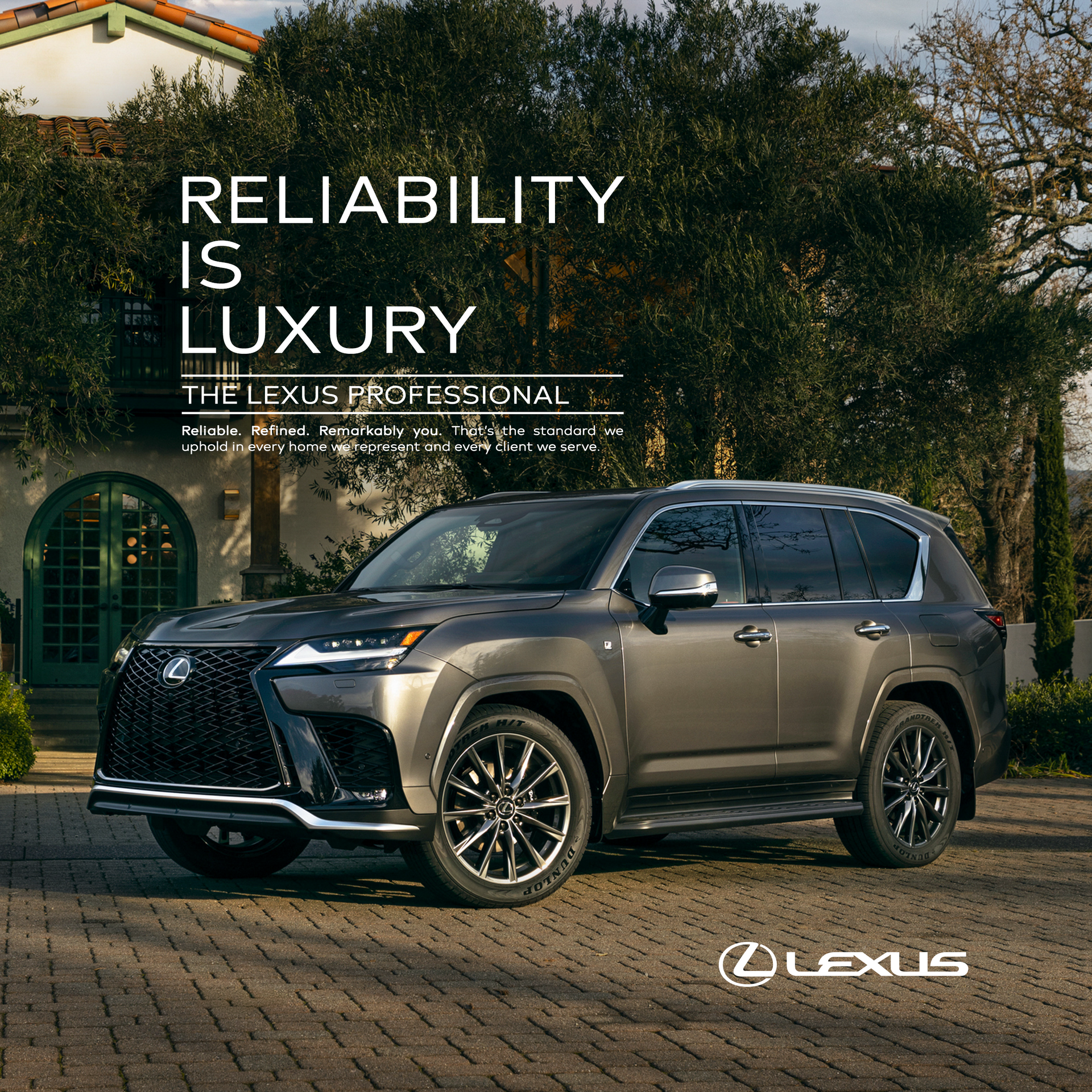 Black Lexus LS 500h on a coastal road with the text