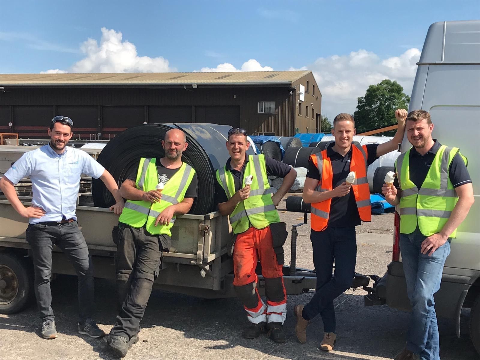 A group of conveyor technicians are posing for a picture in front of a trailer Bradenton, FL.