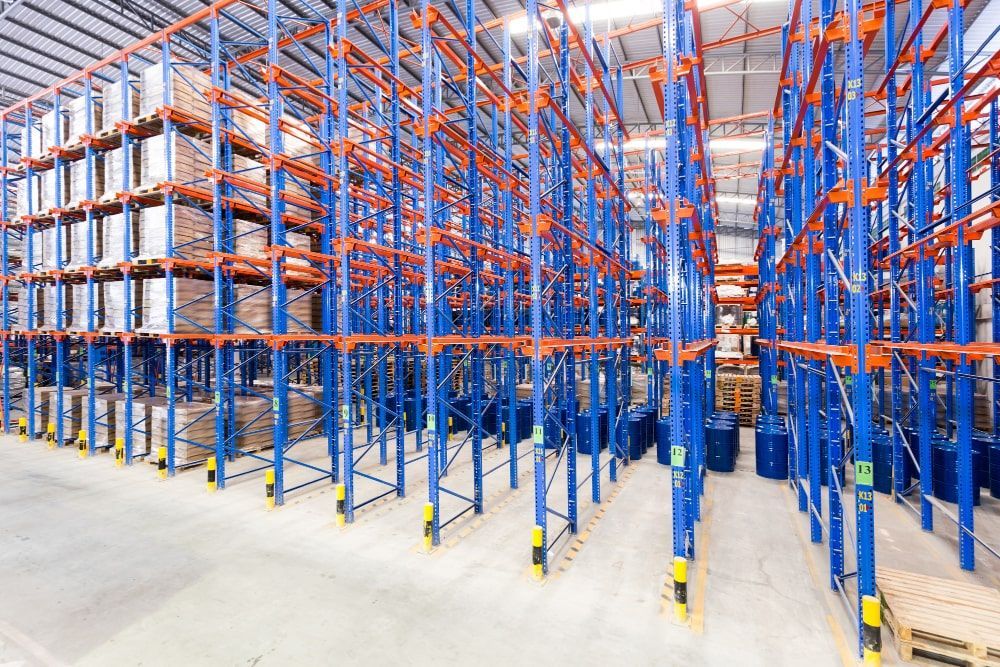 A large Florida warehouse filled with lots of racks and pallets.