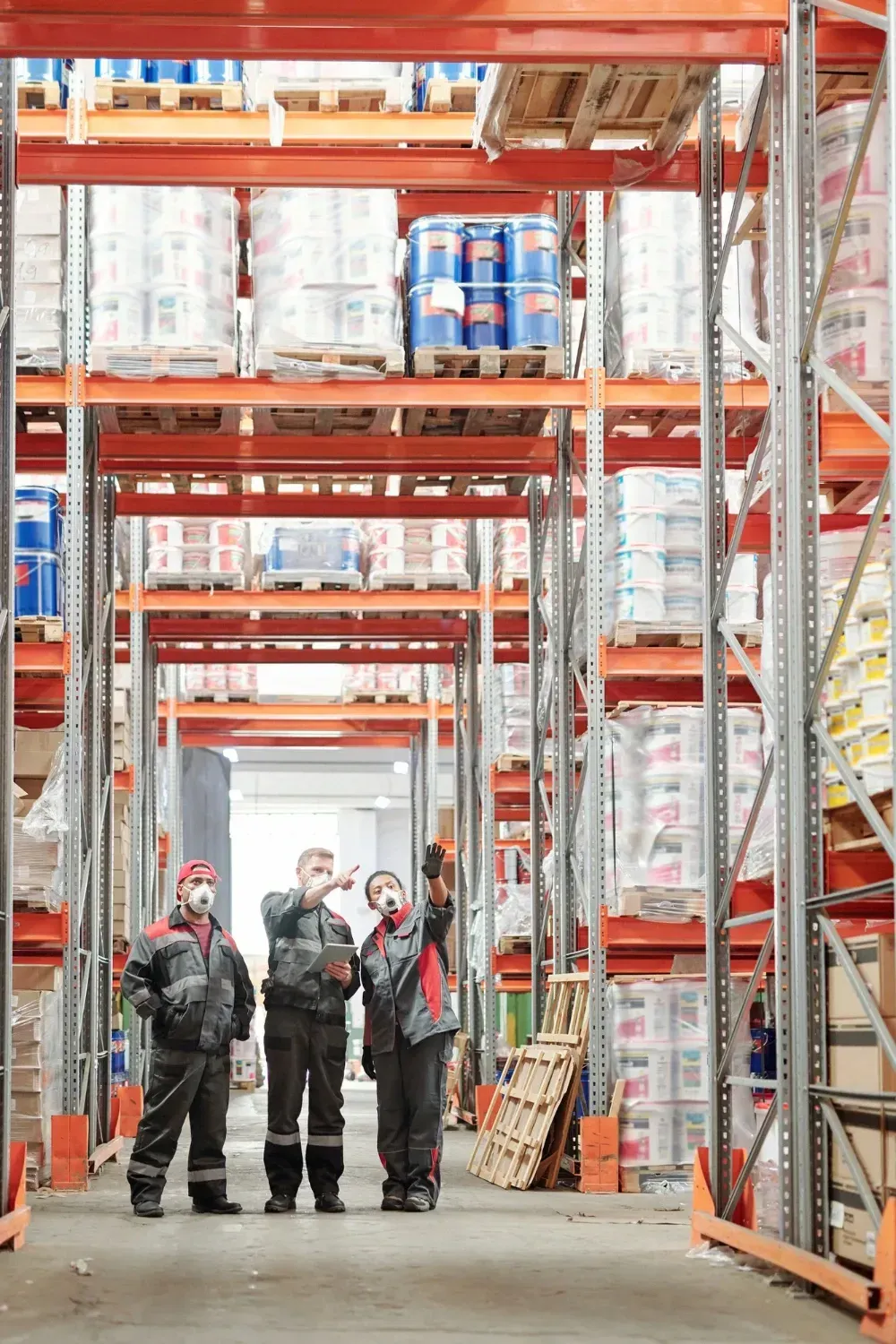 A group of people are standing in a Florida warehouse.