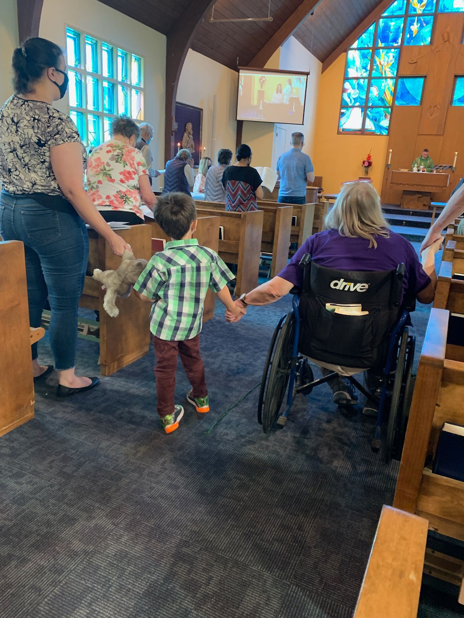 People holding hands in a church