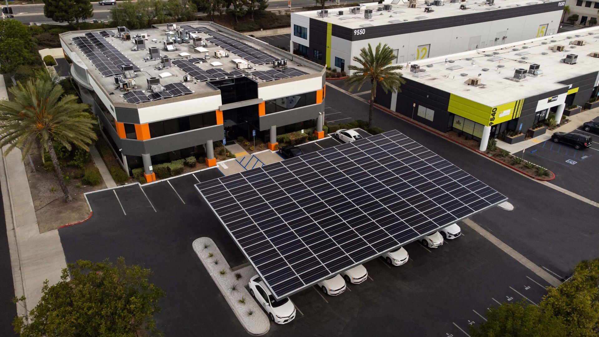 Solar panels covering a parking structure at a commercial building.