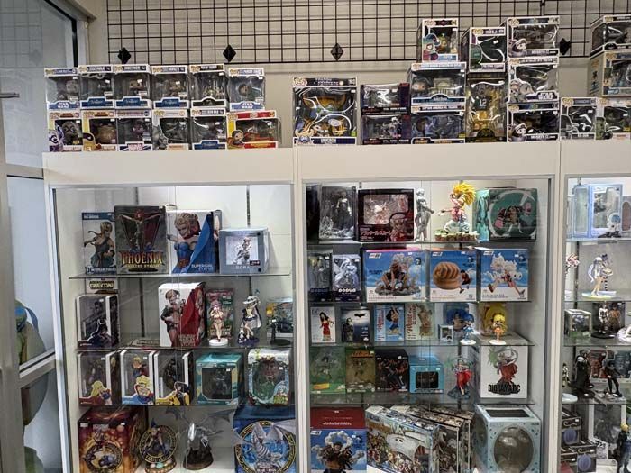 Shelves of anime figures and collectibles in a store.