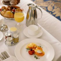 Food Services, Catering, Restaurants and Bars A table with plates of food and a pitcher of orange juice